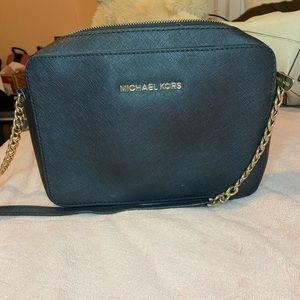 Authentic black and gold MK small size cross body.